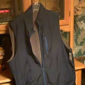 Reversible men’s vest and a pair of Levi’s jeans vest new with tags